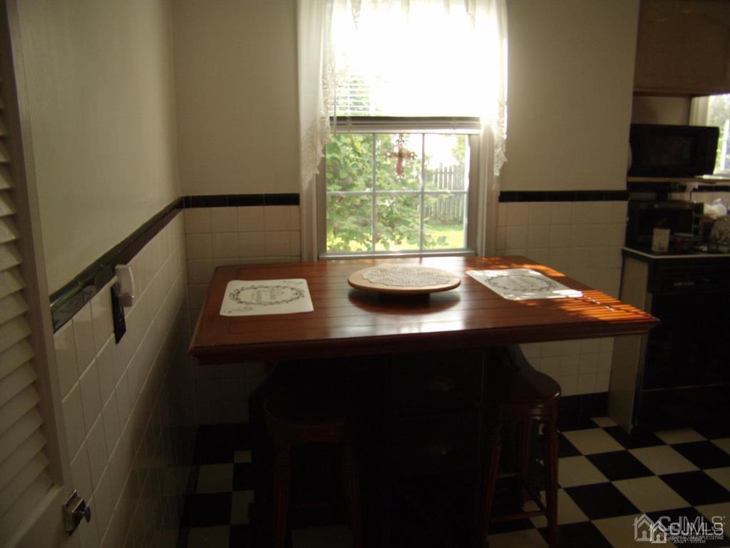 15 State Street Carteret, NJ 07008 - Photo 4 of 5 a view of a workspace with furniture and window