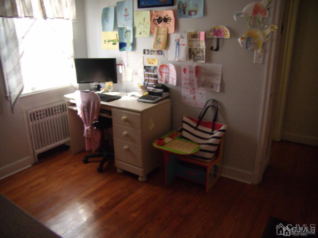 15 State Street Carteret, NJ 07008 - Photo 5 of 5 a room with furniture and wooden floor