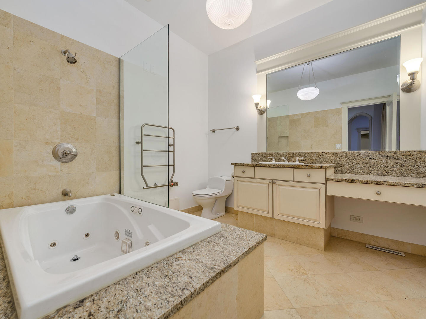 3020 North Sheridan Road, Unit 1N Chicago, IL 60657 - Photo 13 of 29 a bathroom with a granite countertop tub sink and mirror