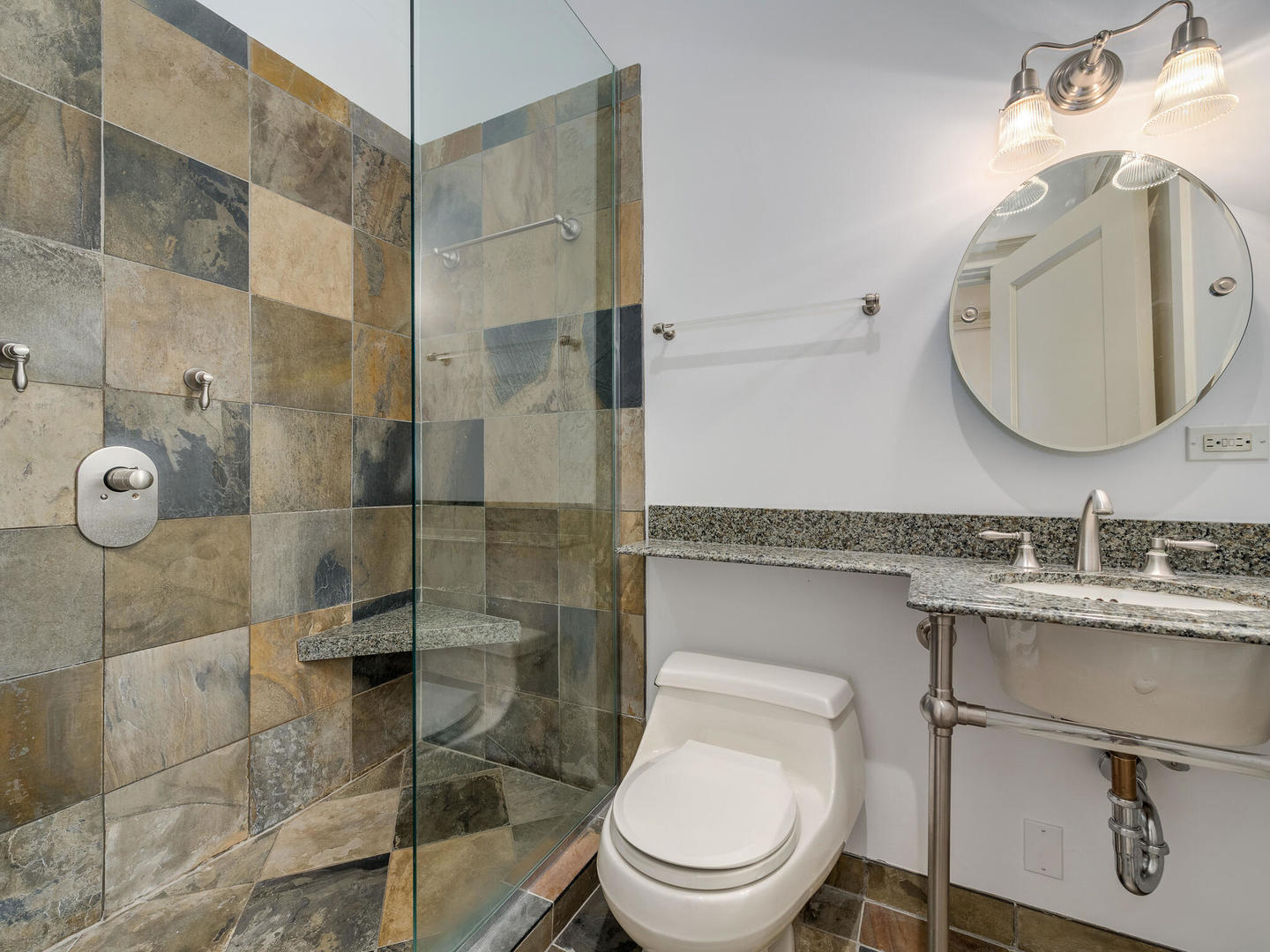 3020 North Sheridan Road, Unit 1N Chicago, IL 60657 - Photo 16 of 29 a bathroom with a toilet sink vanity granite and shower