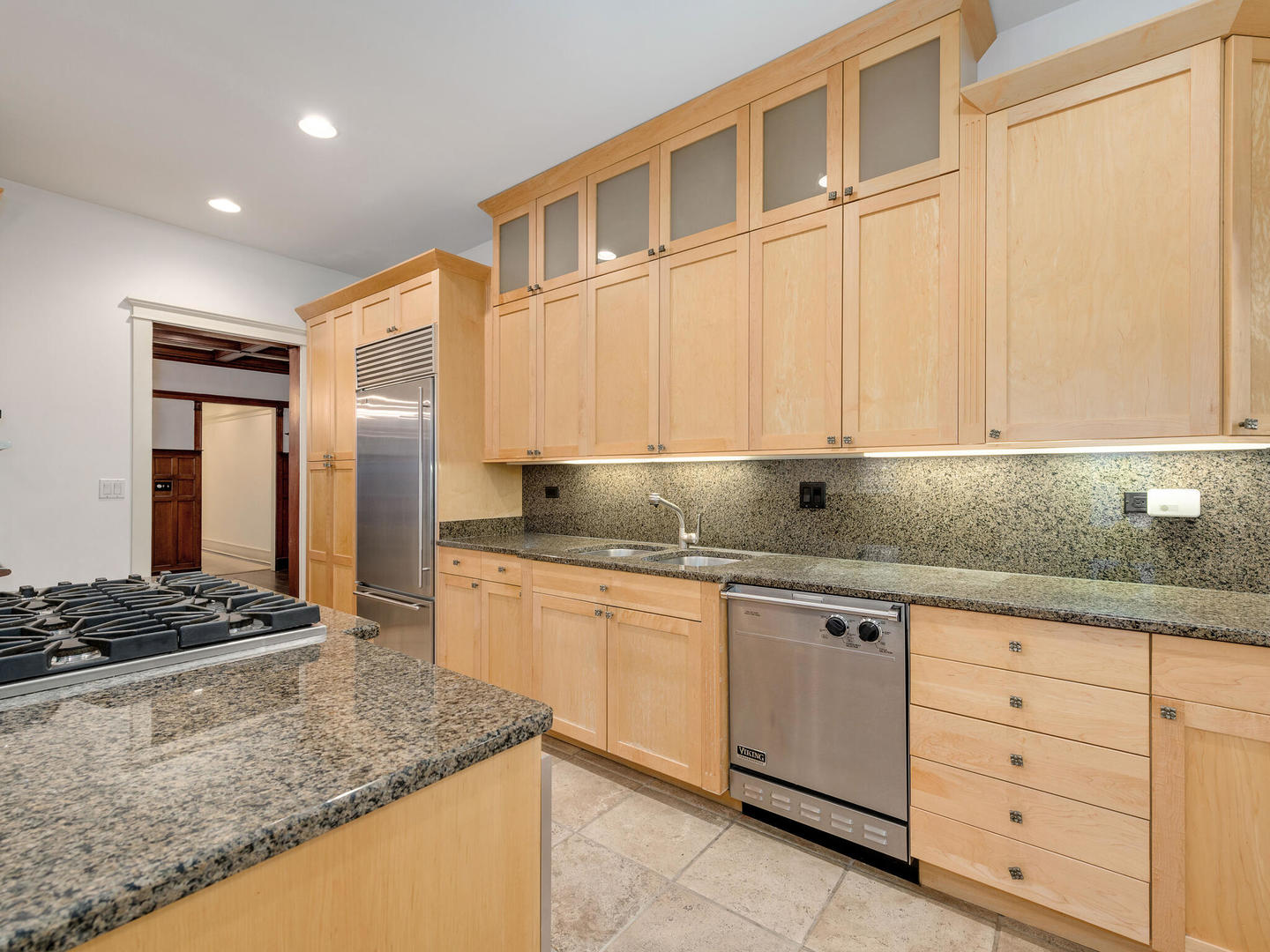 3020 North Sheridan Road, Unit 1N Chicago, IL 60657 - Photo 18 of 29 a kitchen with granite countertop cabinets stainless steel appliances and a counter space