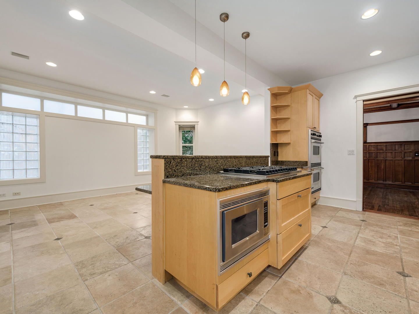 3020 North Sheridan Road, Unit 1N Chicago, IL 60657 - Photo 20 of 29 a kitchen with stainless steel appliances granite countertop a stove and a sink