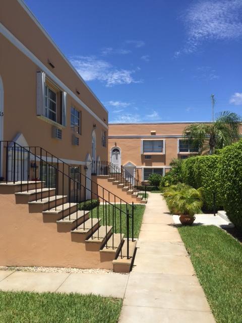 101 South Golfview Road, Unit 16 Lake Worth Beach, FL 33460 - Photo 2 of 16 a view of a swimming pool with a patio