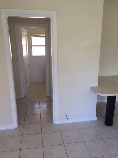 101 South Golfview Road, Unit 16 Lake Worth Beach, FL 33460 - Photo 7 of 16 a view of an empty room and window