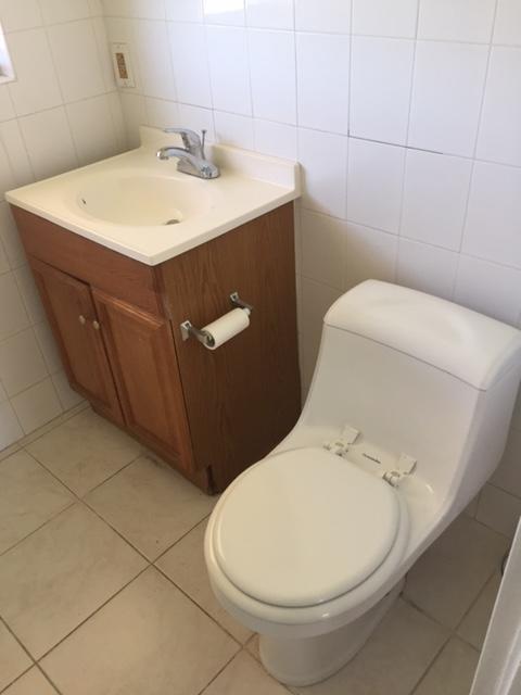 101 South Golfview Road, Unit 16 Lake Worth Beach, FL 33460 - Photo 10 of 16 a bathroom with a sink and a toilet