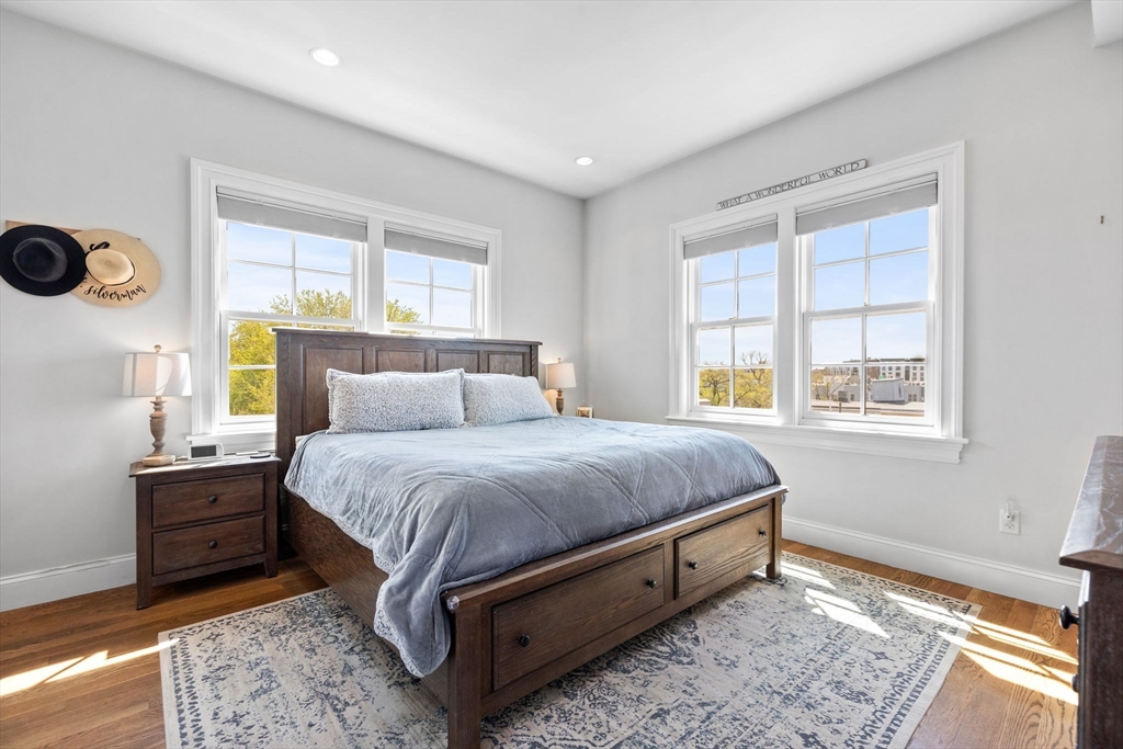 25 Mercer Street, Unit PH5 Boston, MA 02127 - Photo 12 of 22 a bedroom with a bed and window