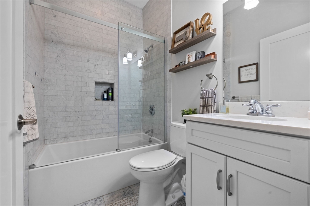 25 Mercer Street, Unit PH5 Boston, MA 02127 - Photo 17 of 22 a bathroom with a sink toilet and shower