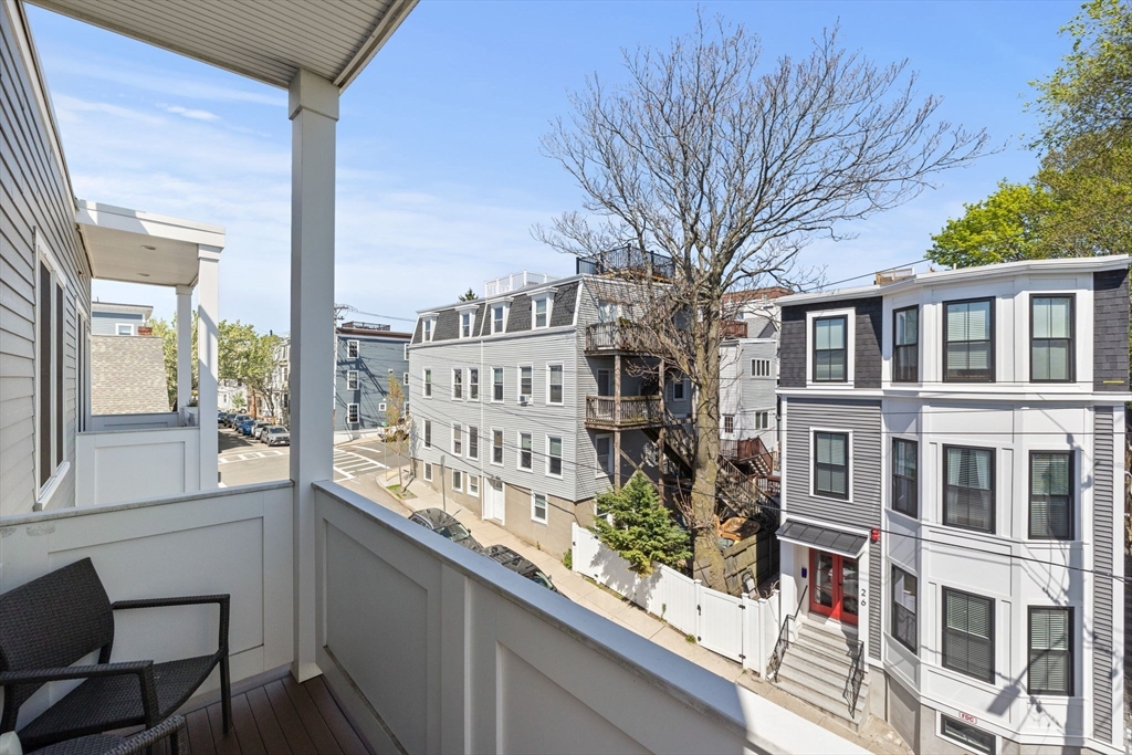 25 Mercer Street, Unit PH5 Boston, MA 02127 - Photo 19 of 22 a view of a large building from a balcony