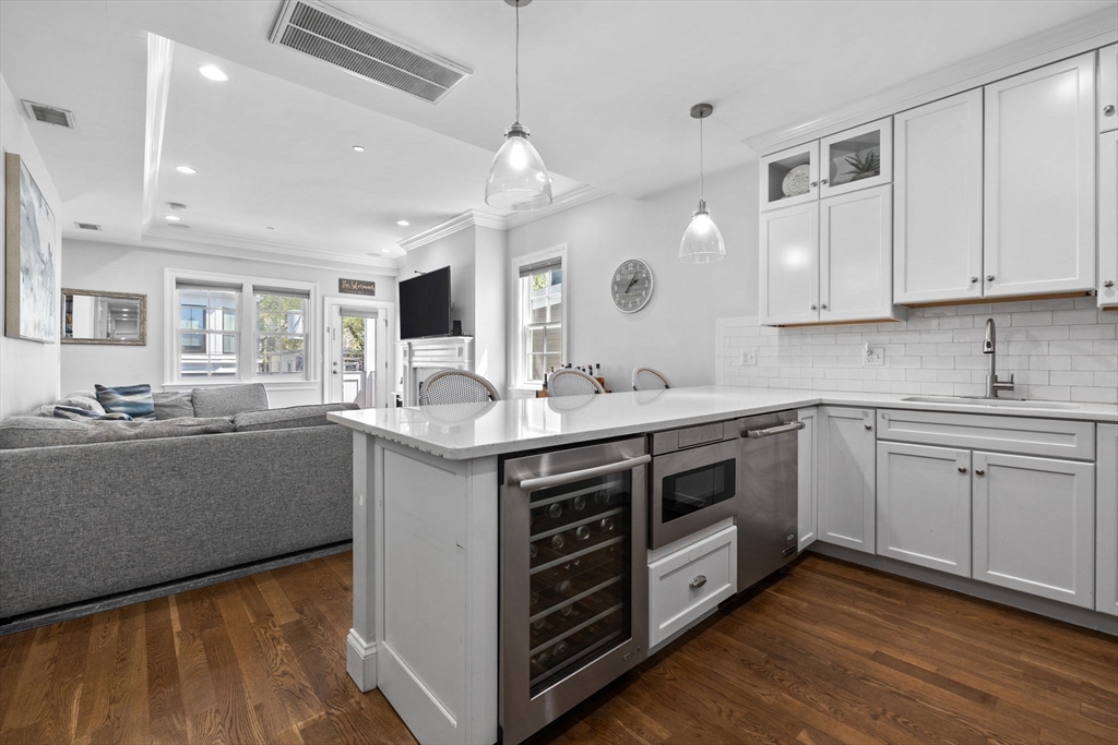 25 Mercer Street, Unit PH5 Boston, MA 02127 - Photo 2 of 22 a kitchen with a sink stove and cabinets