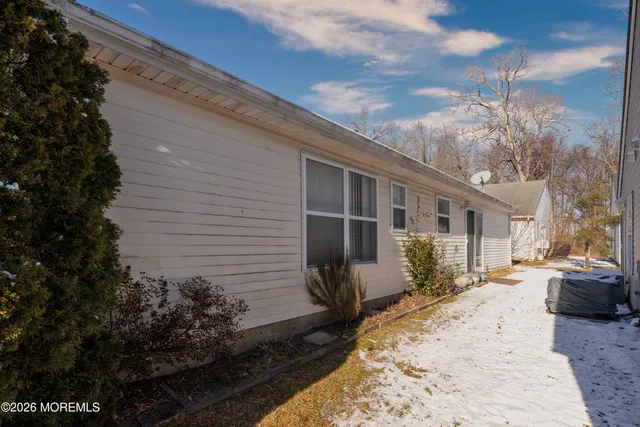 a view of a house with a small yard