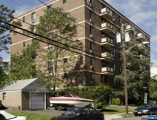 a view of a building with a yard