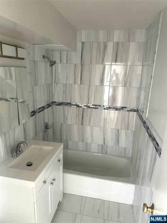 25 Zabriskie Street, Unit 3F Hackensack, NJ 07601 - Photo 5 of 10 a bathroom with a sink and a shower