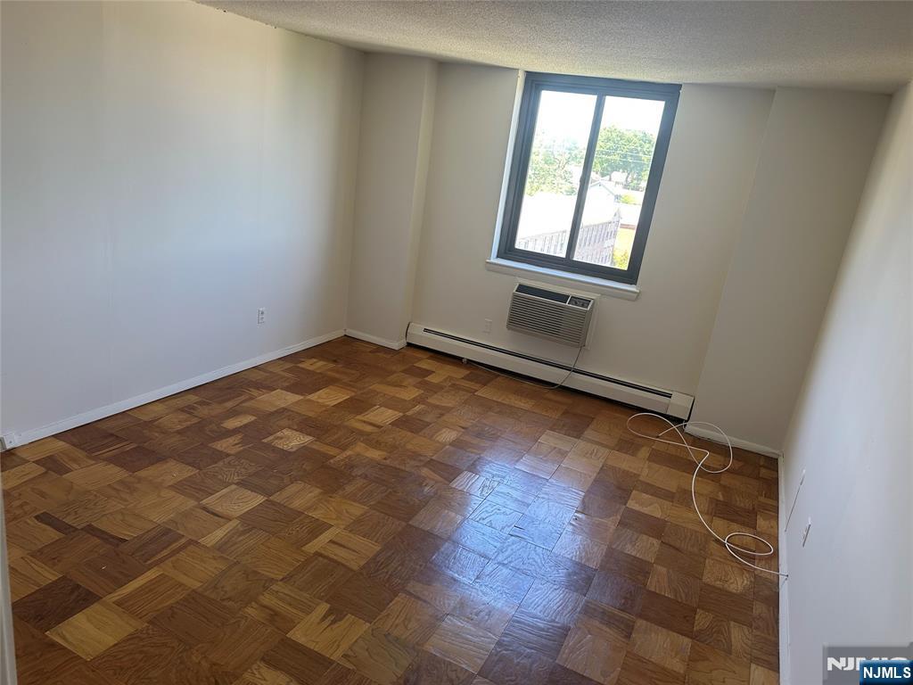 25 Zabriskie Street, Unit 3F Hackensack, NJ 07601 - Photo 7 of 10 an empty room with windows