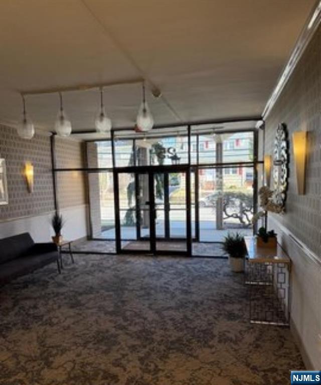 25 Zabriskie Street, Unit 3F Hackensack, NJ 07601 - Photo 8 of 10 a living room with furniture and a large window