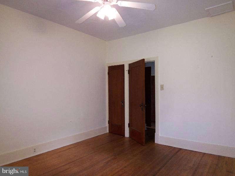2 Warren Street Berkeley Springs, WV 25411 - Photo 13 of 30 an empty room with wooden floor and closet