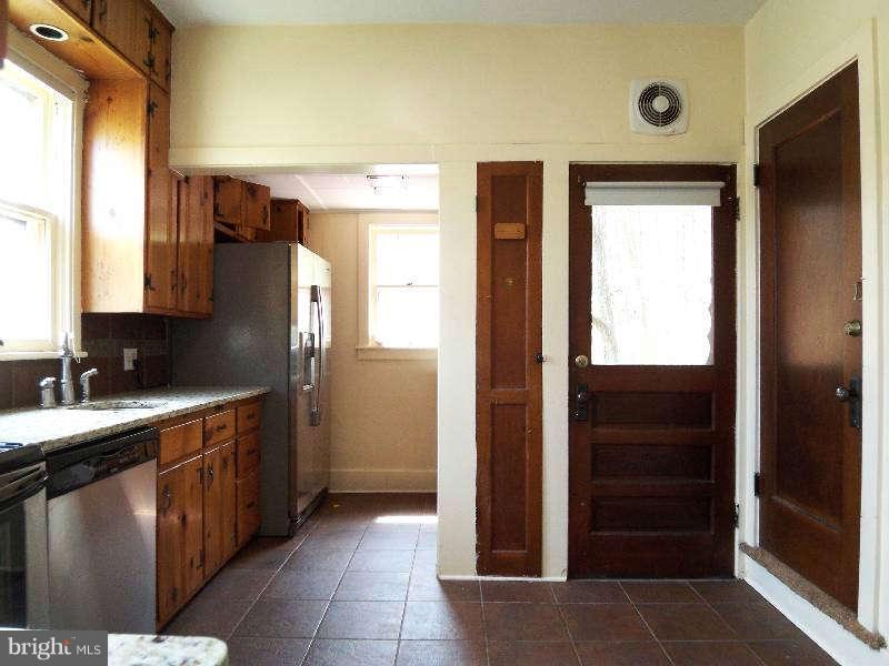2 Warren Street Berkeley Springs, WV 25411 - Photo 17 of 30 a kitchen with a refrigerator and a sink