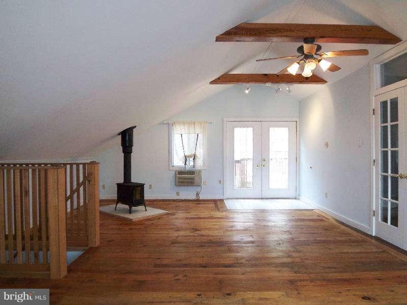 2 Warren Street Berkeley Springs, WV 25411 - Photo 29 of 30 a view of an empty room with a window and wooden floor