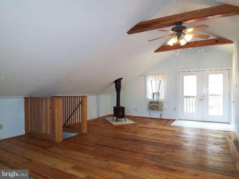 2 Warren Street Berkeley Springs, WV 25411 - Photo 30 of 30 a view of empty room with wooden floor and fan