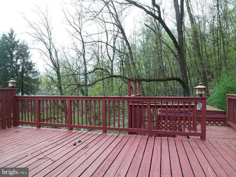 2 Warren Street Berkeley Springs, WV 25411 - Photo 4 of 30 a view of deck with wooden floor and fence