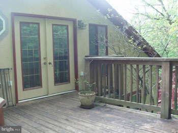 2 Warren Street Berkeley Springs, WV 25411 - Photo 7 of 30 a view of a balcony with chair