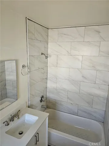 a bathroom with a sink and a shower