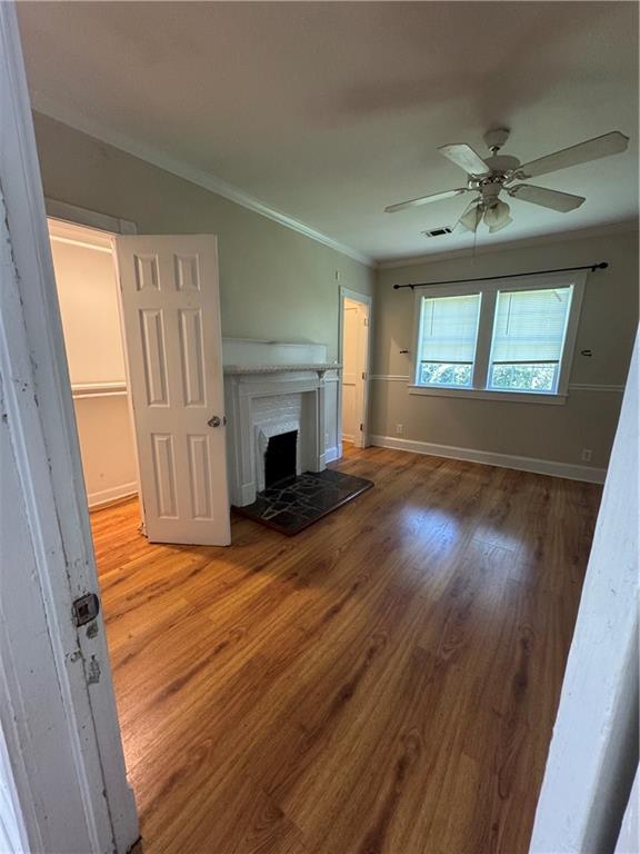 1230 South Madison Avenue Monroe, GA 30655 - Photo 20 of 37 a view of empty room with wooden floor and fan