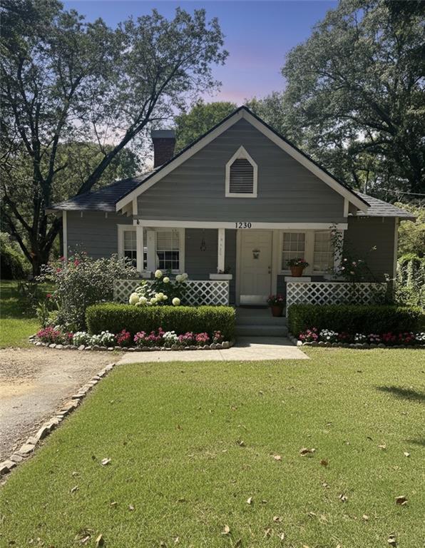 1230 South Madison Avenue Monroe, GA 30655 - Photo 2 of 37 a front view of house with yard and green space