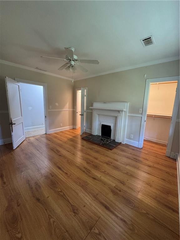 1230 South Madison Avenue Monroe, GA 30655 - Photo 21 of 37 a view of empty room with wooden floor and fireplace