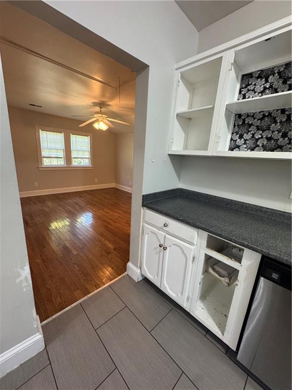 1230 South Madison Avenue Monroe, GA 30655 - Photo 28 of 37 a kitchen with white cabinets and a stove