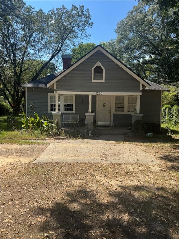 1230 South Madison Avenue Monroe, GA 30655 - Photo 37 of 37 a front view of house with yard and trees around