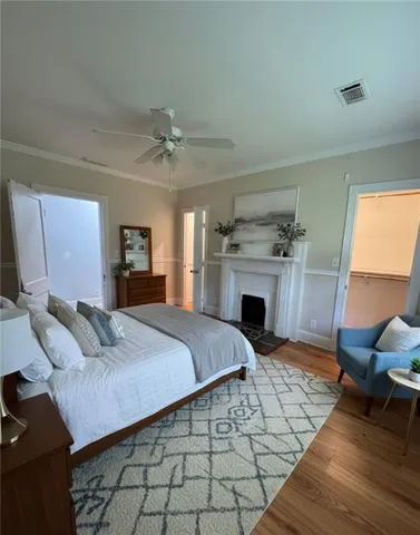 a living room with furniture a chandelier and a window
