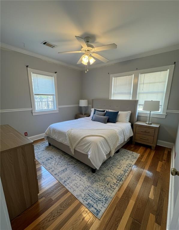 1230 South Madison Avenue Monroe, GA 30655 - Photo 10 of 37 a bedroom with a bed and window