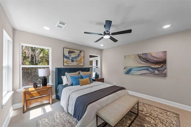 a bedroom with a large bed and a window