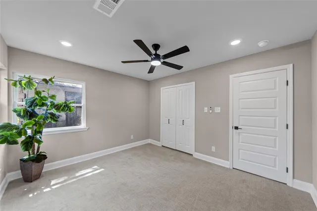 a view of an empty room with a potted plant