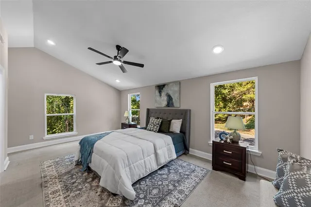 a bed room with a bed and a window