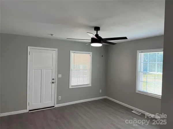 a view of an empty room with a window