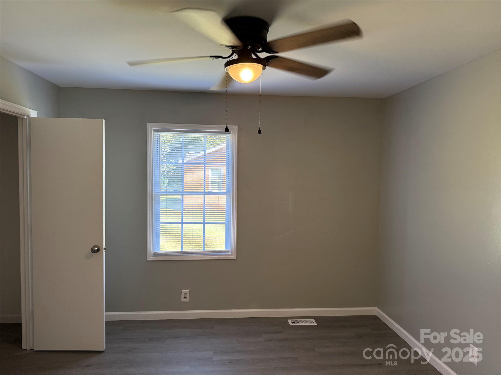 837 Sikes Mill Road Monroe, NC 28110 - Photo 10 of 16 a view of an empty room with a window