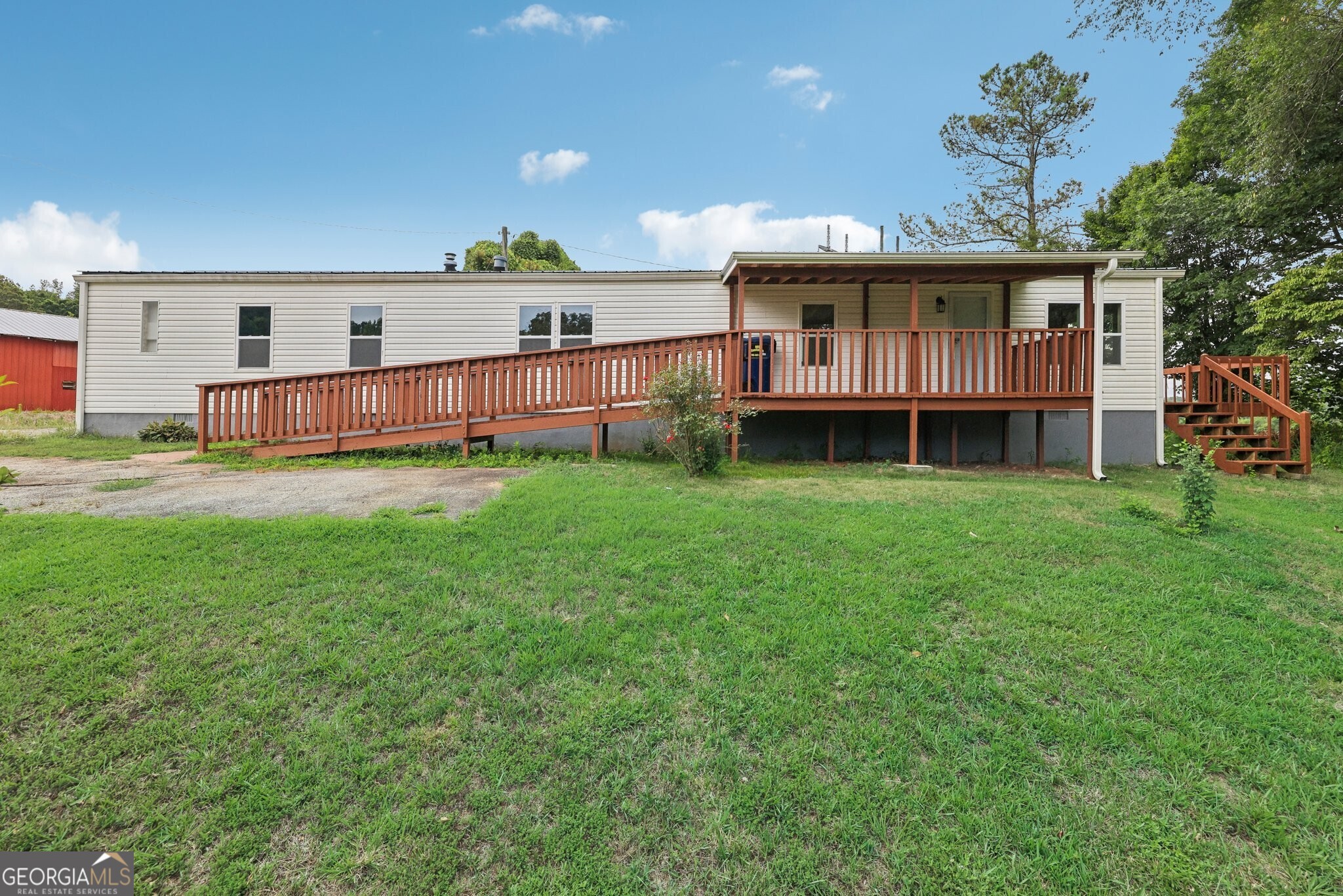 878 Thompson Road Dawsonville, GA 30534 - Photo 1 of 1 a view of a house with a yard and sitting area