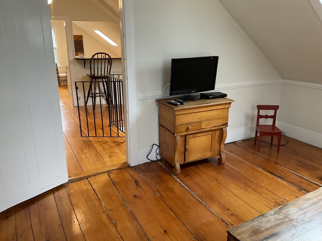 1 Middle Street, Unit 3 Marblehead, MA 01945 - Photo 3 of 16 a room with furniture and flat screen tv