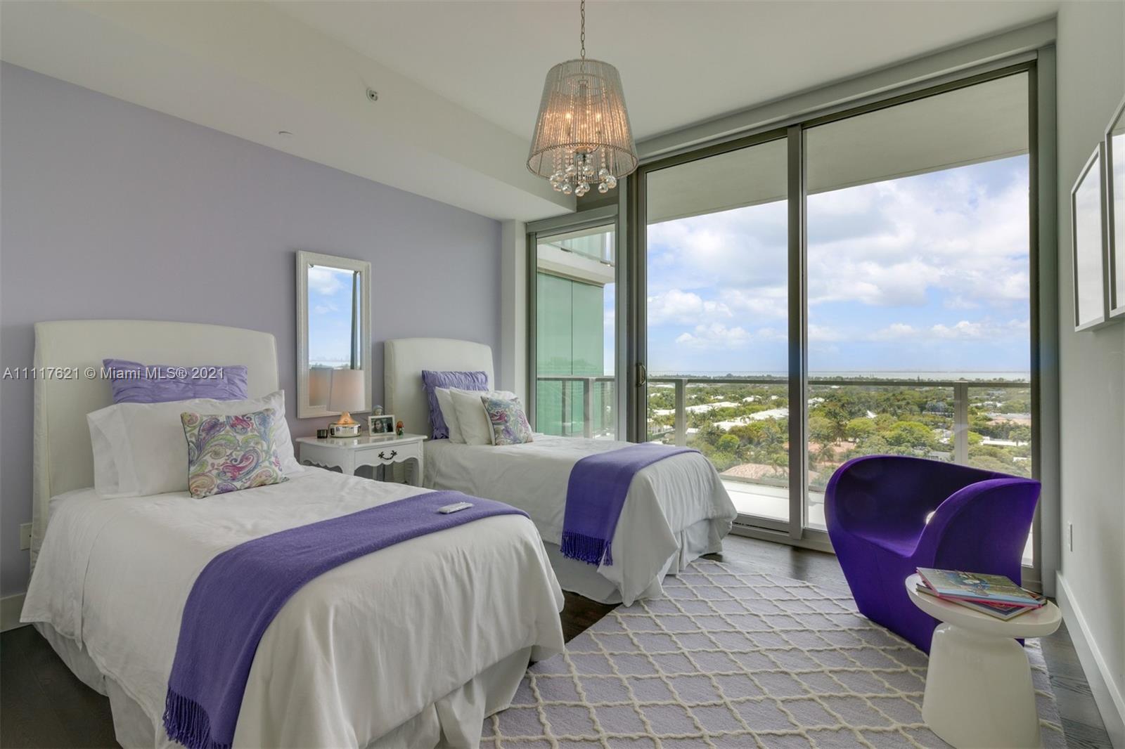 360 Ocean Drive, Unit 1106S Key Biscayne, FL 33149 - Photo 19 of 35 a bed room with two beds and a large window