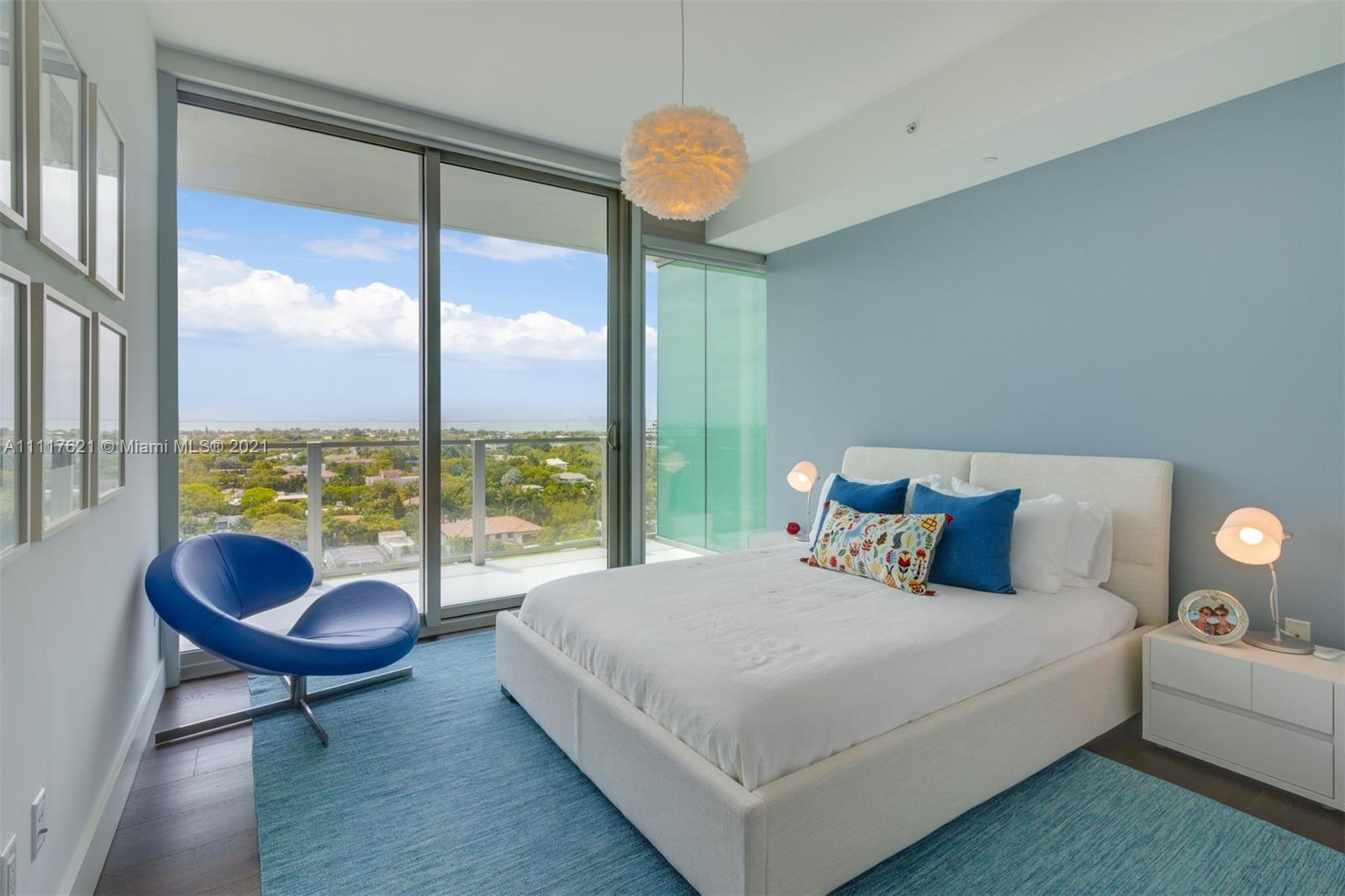 360 Ocean Drive, Unit 1106S Key Biscayne, FL 33149 - Photo 22 of 35 a bedroom with a bed and a large window
