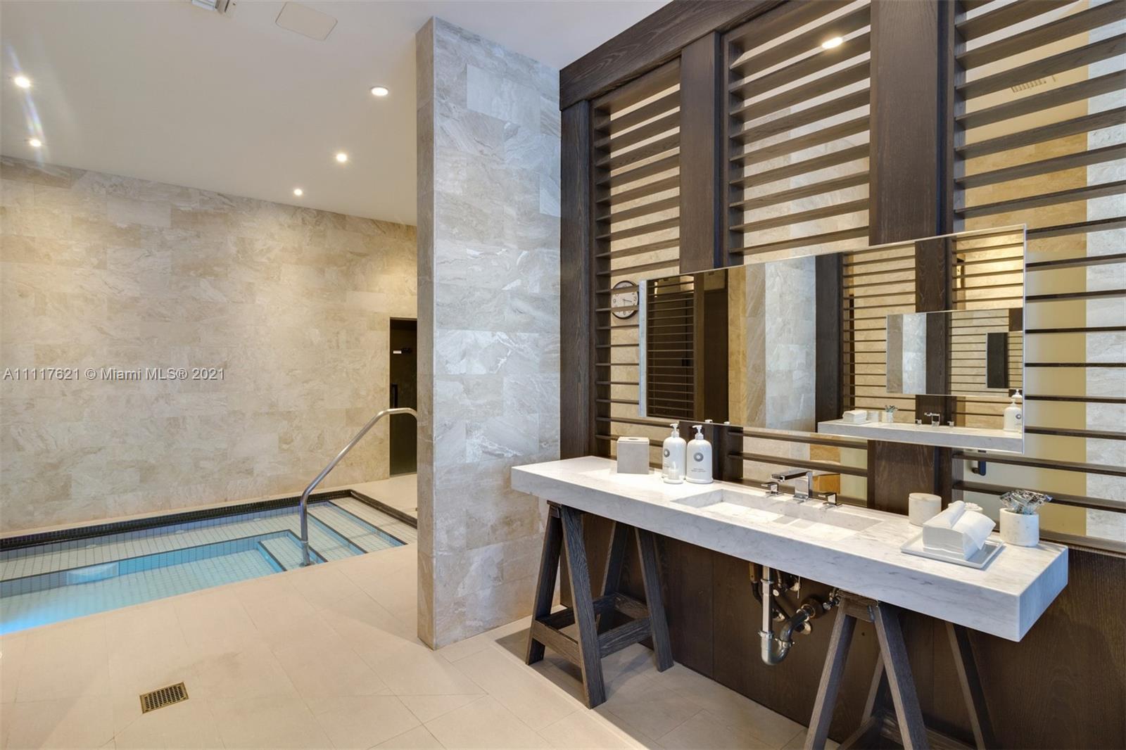 360 Ocean Drive, Unit 1106S Key Biscayne, FL 33149 - Photo 30 of 35 a bathroom with a double vanity sink and a mirror