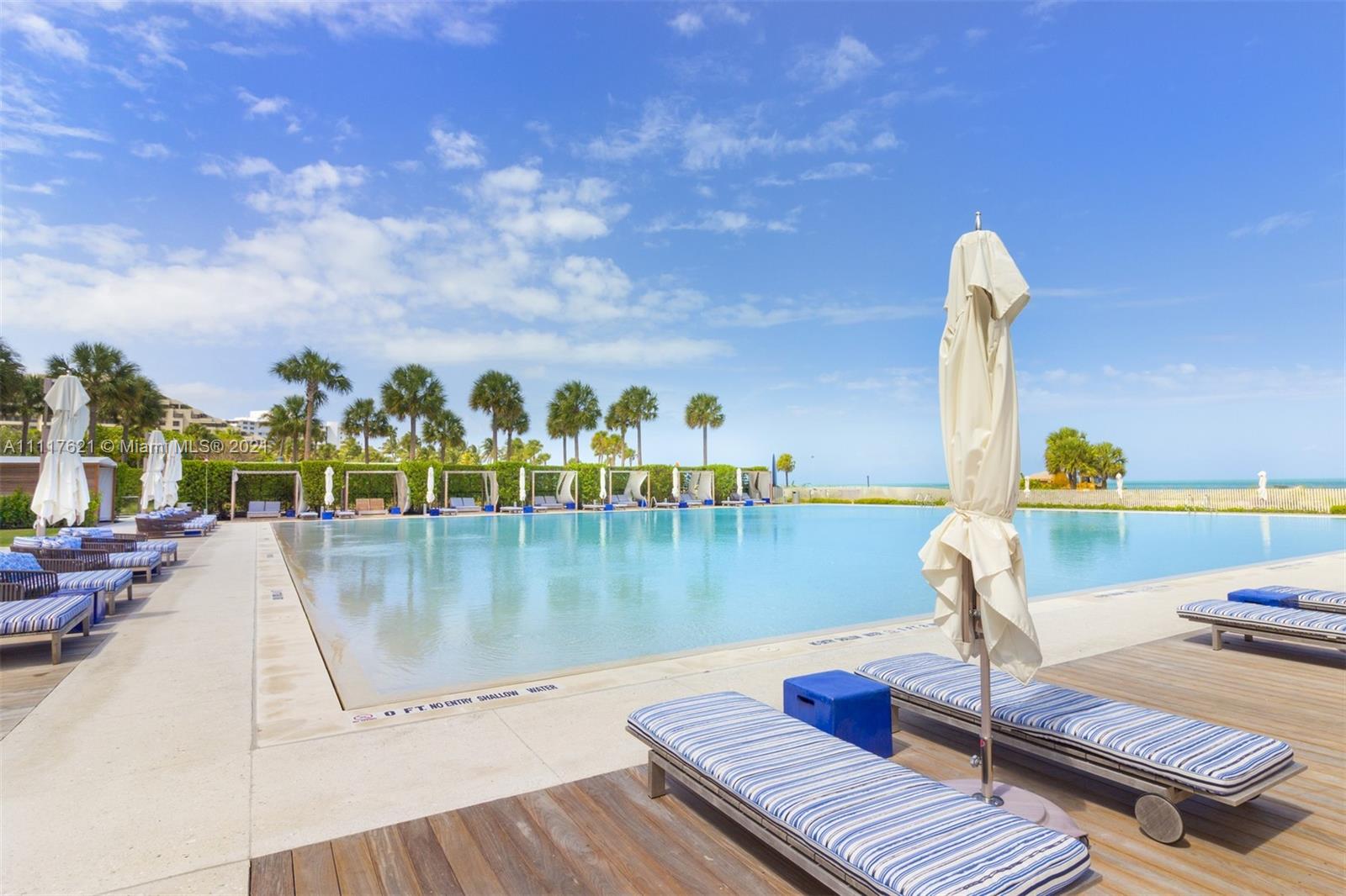 360 Ocean Drive, Unit 1106S Key Biscayne, FL 33149 - Photo 33 of 35 a view of a swimming pool with a terrace