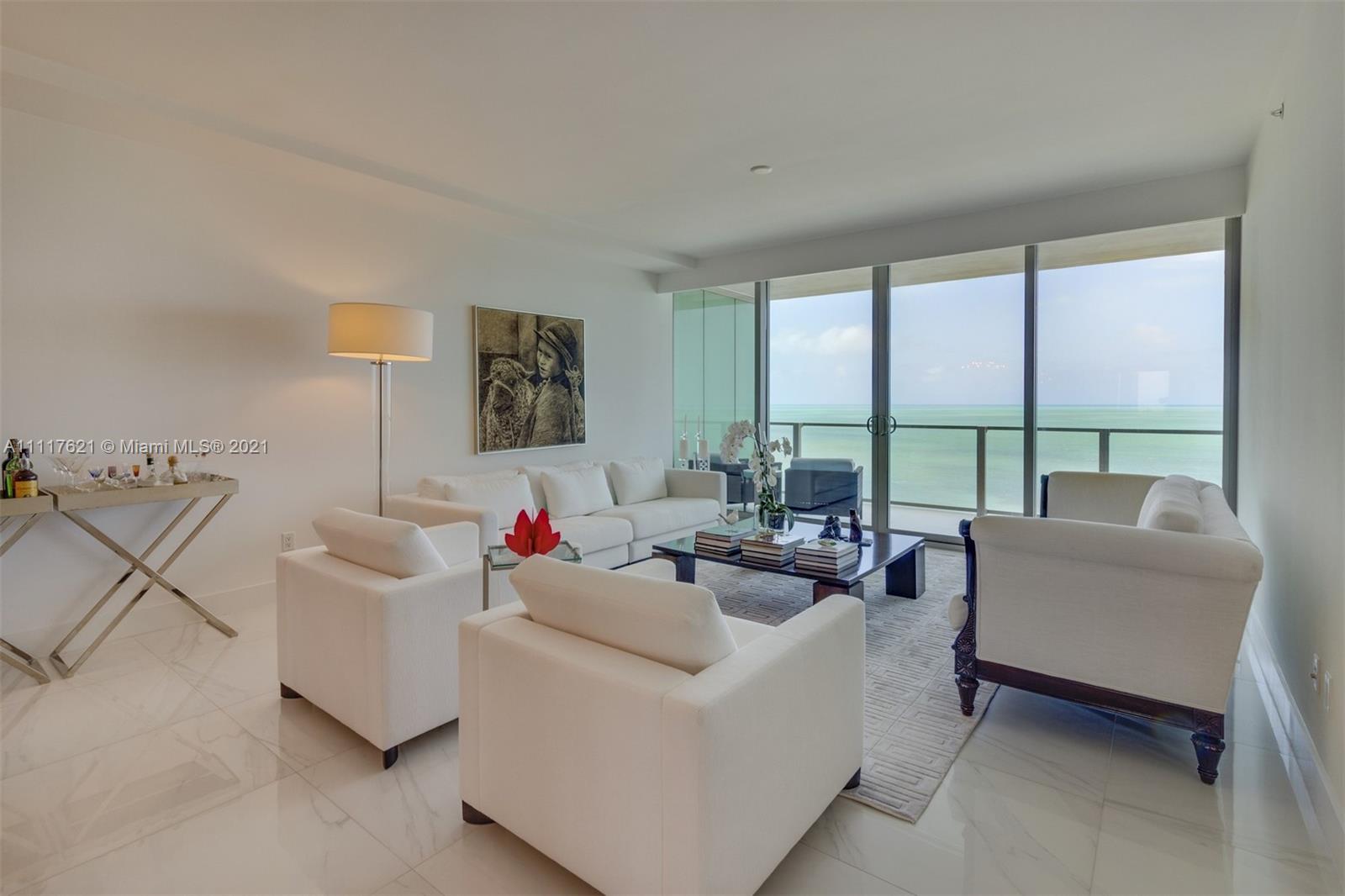 360 Ocean Drive, Unit 1106S Key Biscayne, FL 33149 - Photo 5 of 35 a living room with furniture and a large window