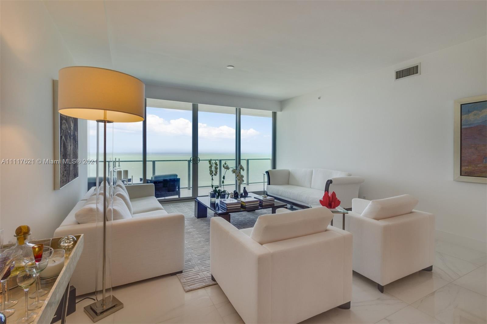 360 Ocean Drive, Unit 1106S Key Biscayne, FL 33149 - Photo 6 of 35 a room with furniture and a large window