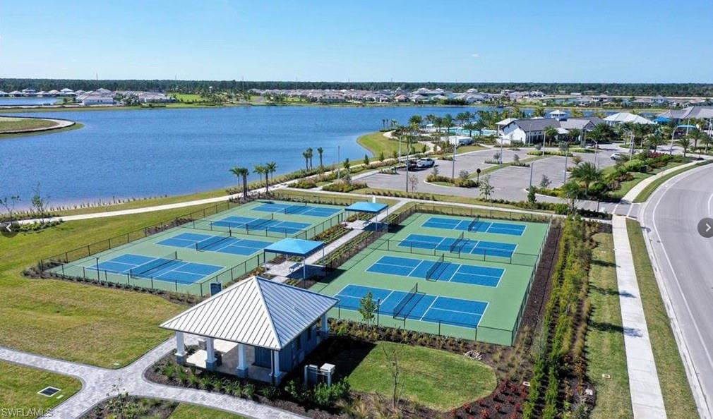 3998 Perseus Street Naples, FL 34120 - Photo 23 of 26 Aerial view of residential area with a nearby body of water