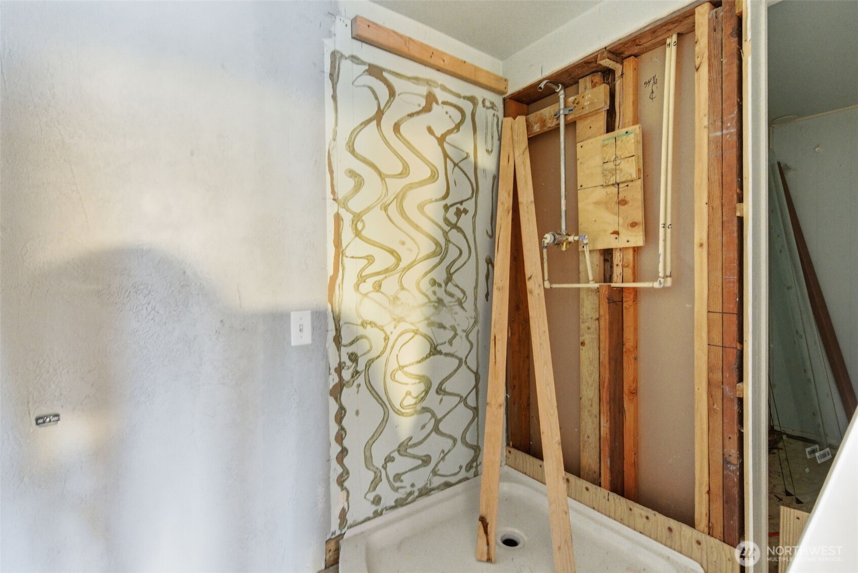 153 Davidson Drive Sequim, WA 98382 - Photo 11 of 36 a bathroom with a shower and a door