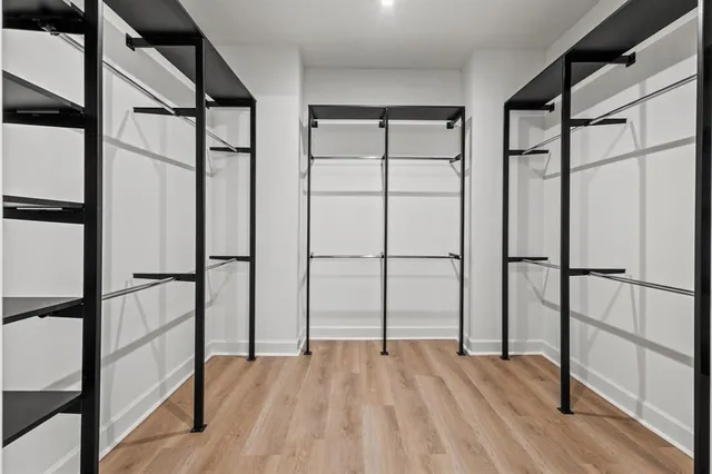 a view of staircase with wooden floor and window