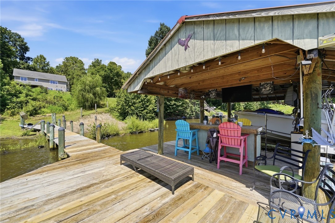 210 Riverview Road Stevensville, VA 23161 - Photo 49 of 63 Expansive waterfront dock with a covered bar area,