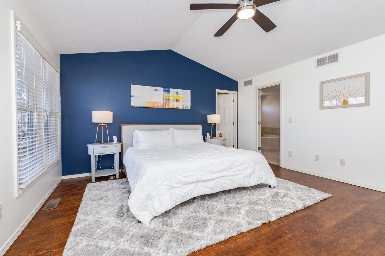 1223 Joy Walk Way Normal, IL 61761 - Photo 20 of 48 a bedroom with a large bed and a chandelier